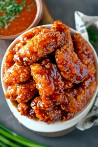 "Freshly cooked Simple Chicken Air Fryer Tenders with a golden, crispy coating on a serving plate." 