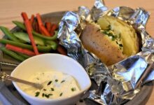 juicy-steak-with-crispy-baked-potato-on-wooden-plate