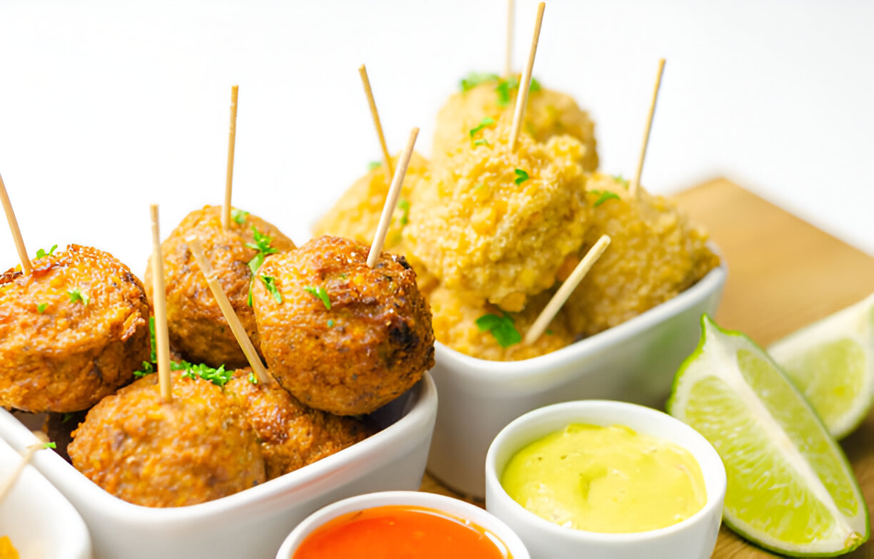 Assorted mini chicken kievs and sweet potato falafels served with saucesssorted mini chicken kievs and sweet potato falafels served with sauces